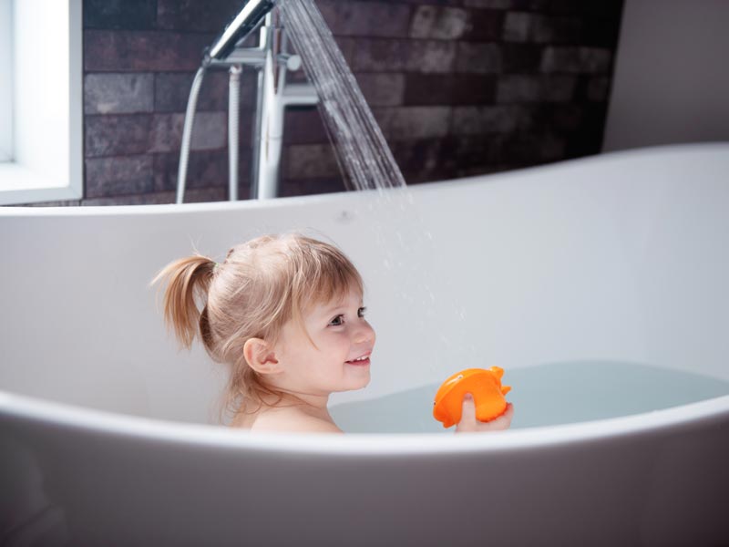 little girl taking bath